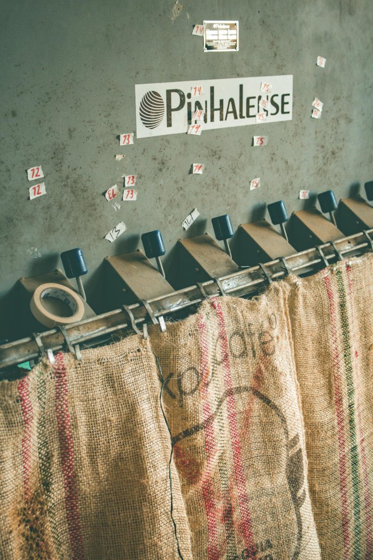 Close-up of coffee processing machinery with burlap sacks. Captured in Pichinde, Colombia.